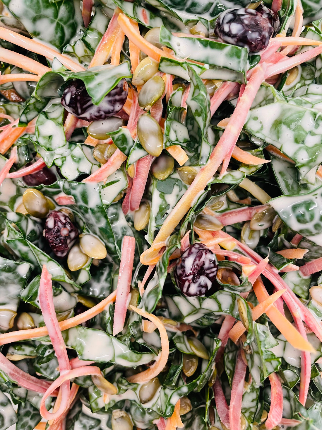 Kale, Rainbow Carrot, Cranberry and Pumpkin Seed Slaw